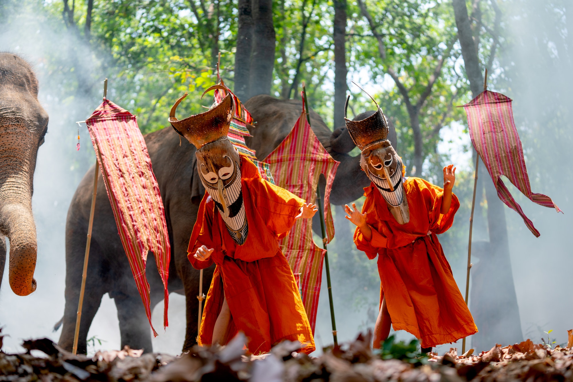 Two boy wear Pee Ta Khon, traditional culture art as ghost of Asian culture, dress and action