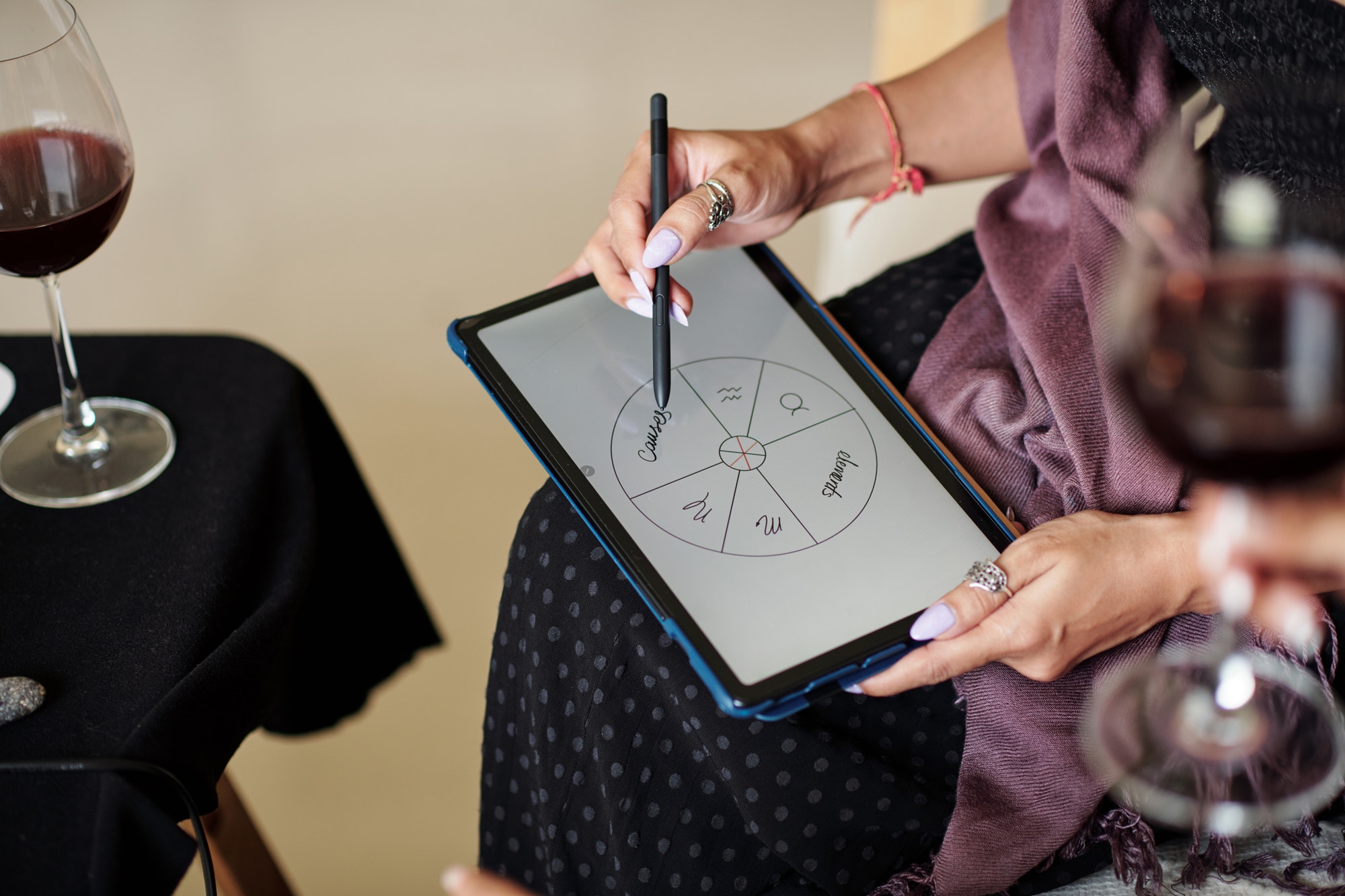 Astrologer Drawing Natal Card on Tablet